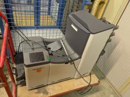 Photo détaillant le don Machine de mise sous pli